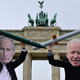 Peace activists wearing masks of Russian President Vladimir Putin (L) and newly elected US President Joe Biden pose with mock nuclear missiles in front of Berlin’s landmark the Brandenburg Gate on January 29, 2021 in an action to call for more progress in nuclear disarmament.